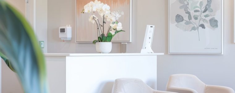 Bright and airy reception area in a botox clinic, showcasing sleek modern furniture and a welcoming receptionist at the front desk. the space features natural light, minimalist decor, and a professional, inviting atmosphere.