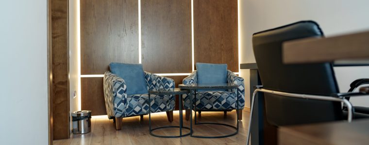 Stylish Office waiting area with arm chairs and coffee table